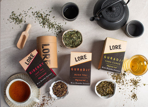 A beautifully arranged collection of various LORE Australia teas, showcasing an array of colors and packaging designs.